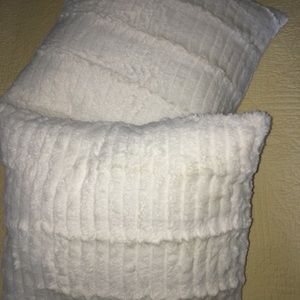 Two 20 x 20 white fake fur pillows